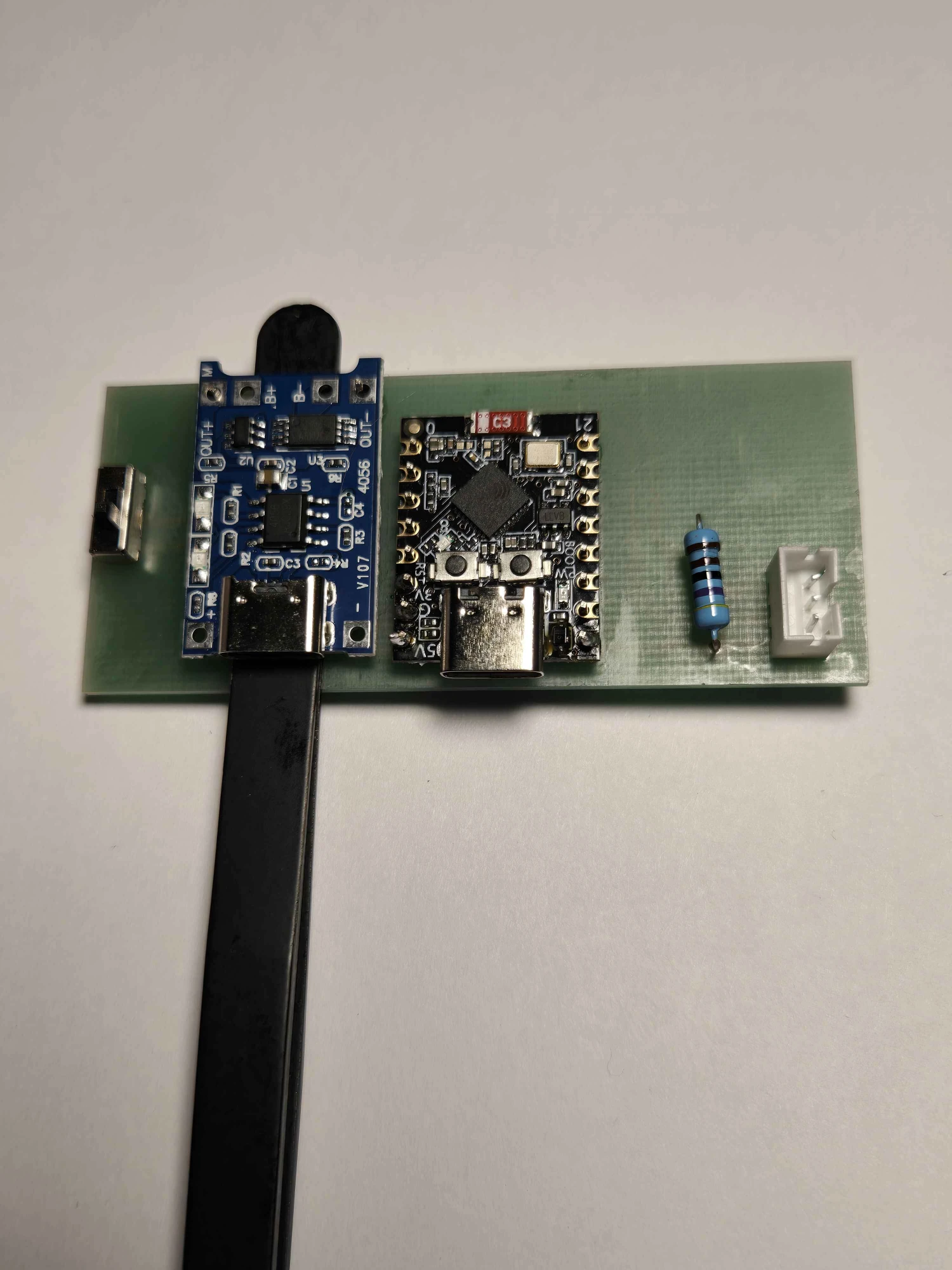 TP4056 module soldered onto the carrier